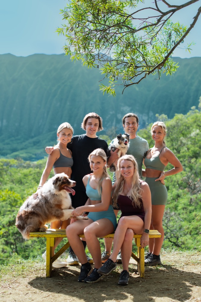 Laura with her family in Hawaii, all in athletic wear
